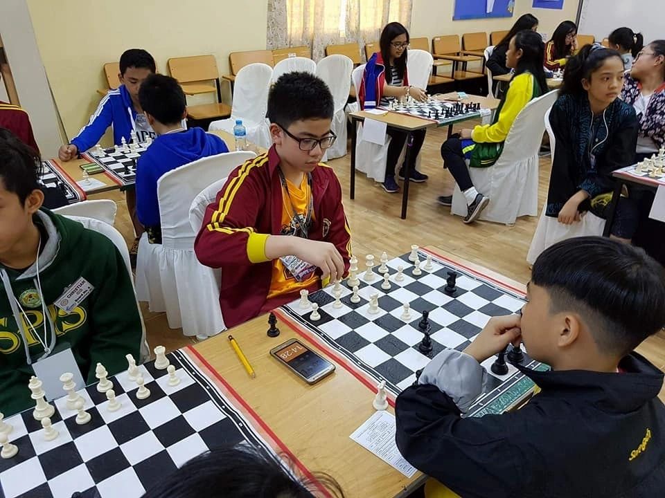 Students participating in chess